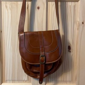 Large one big pocket one small pocket on the outside cross body bag light brown